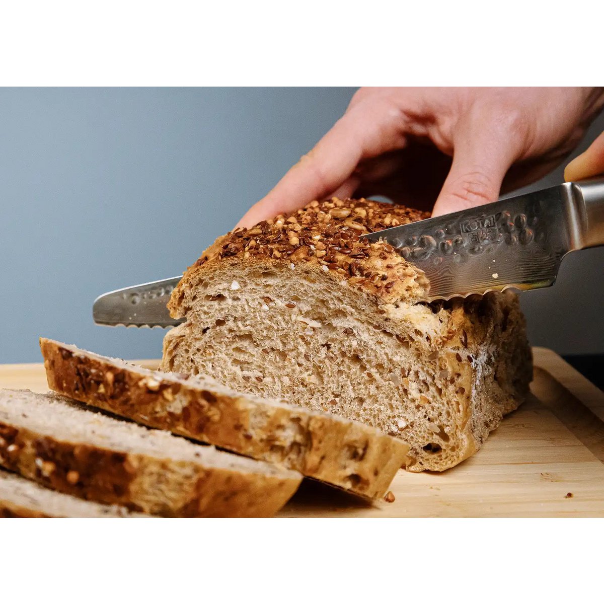 Damast-Brotmesser mit Wellenschliff 200 mm - Holzgriff
